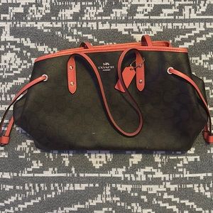 Coach purse with pink interior